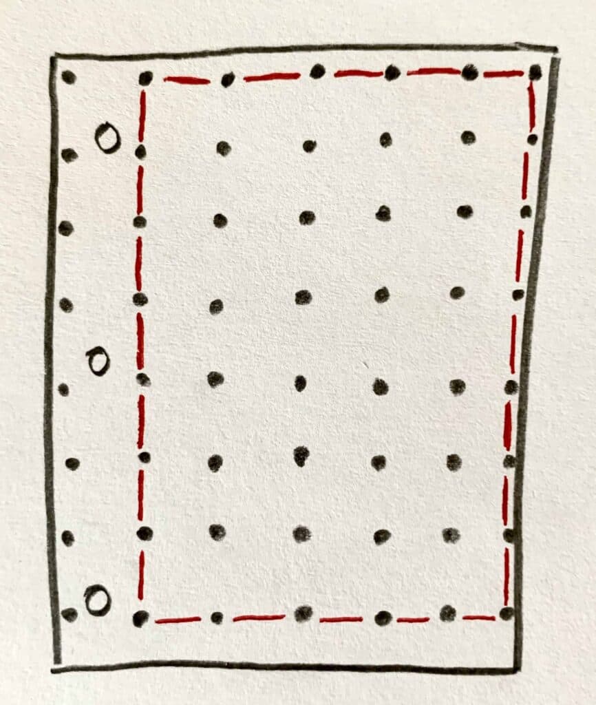 drawing of an open notebook with margins and full spaces marked out around binder holes