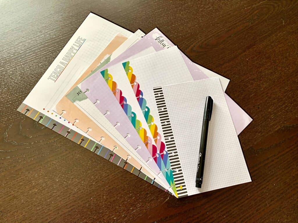 Photograph of several different sizes and styles of The Happy Planner paper